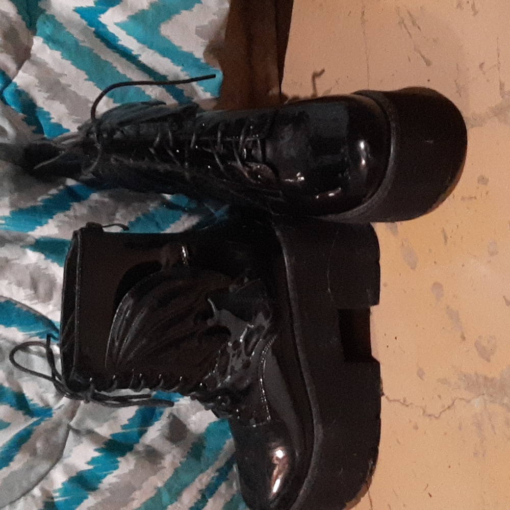 Platform boots with bat wigs